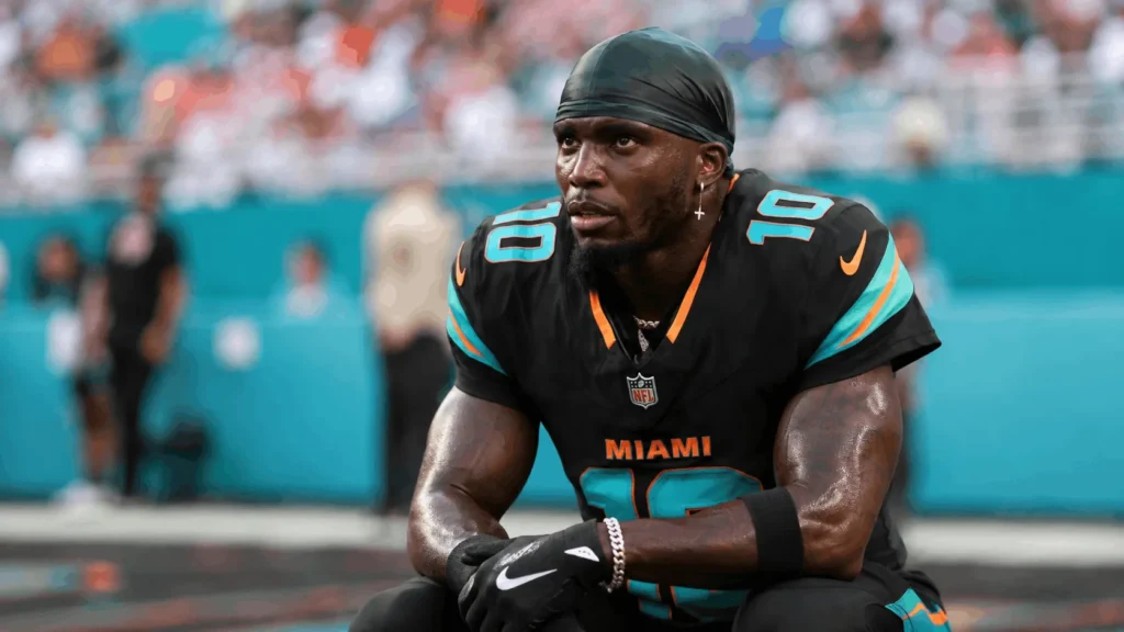Tyreek Hill celebrating with the Dolphins during the contract years tied to his net worth growth